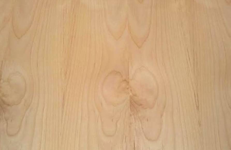A close up of the wood grain on a table.